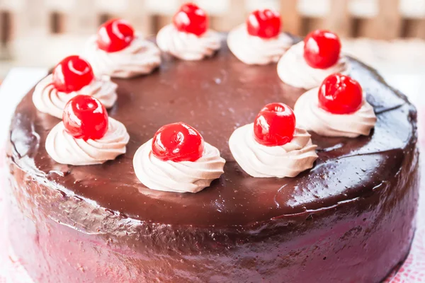 Chocolate cake with cherry and whipped cream — Stock Photo, Image