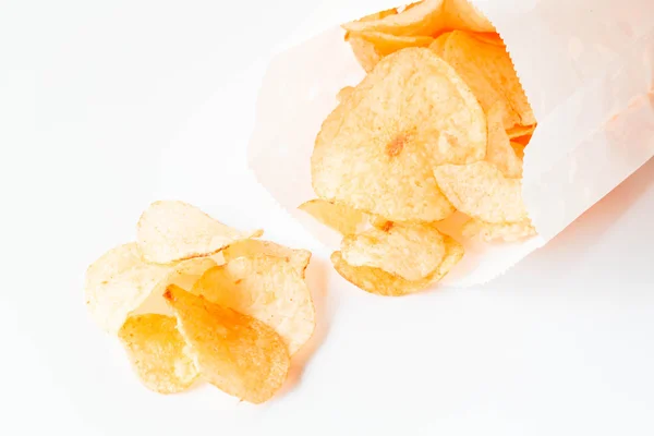 Potato chips snack falling out of the pack — Stock Photo, Image