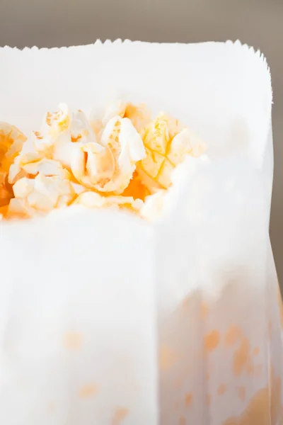 Fresh classic butter popcorn in paper bag — Stock Photo, Image