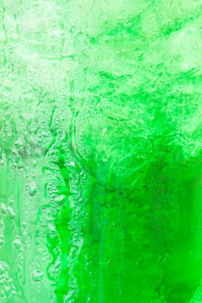 Sweet green water with ice cubes background — Stock Photo, Image