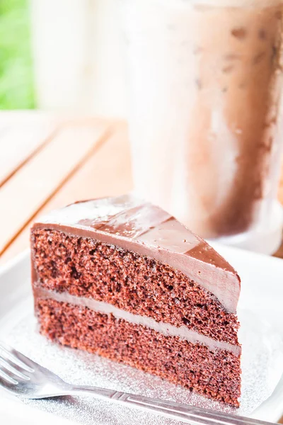 Bitter sweet meal with iced coffee and chocolate cake — Stock Photo, Image