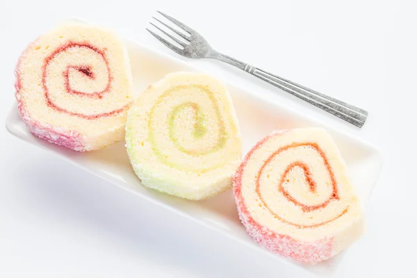 Prato de bolos de rolo de engarrafamento coloridos com garfo — Fotografia de Stock