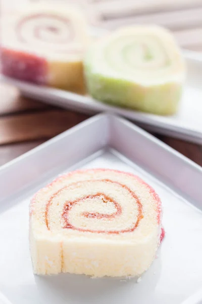 Colorful jam rolls served on wood table — Stock Photo, Image