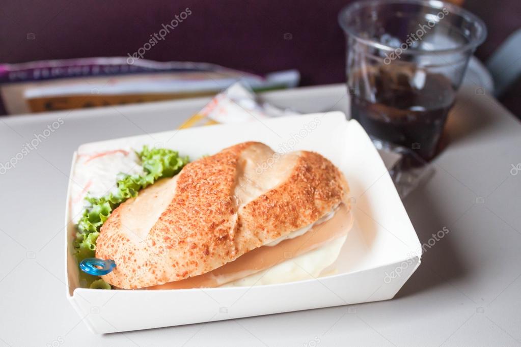 Easy meal with sausage burger served on the plane