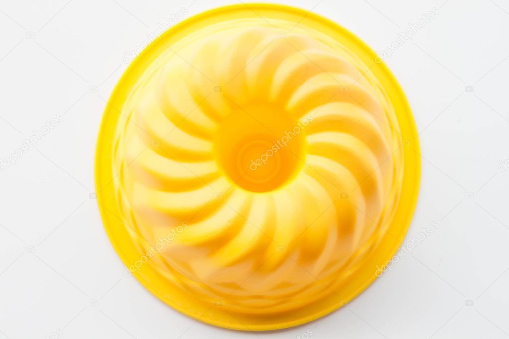 Flexible silicone form for baking cake isolated on white backgro