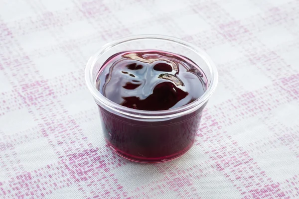 Cup of delicious blueberry sauce — Stock Photo, Image