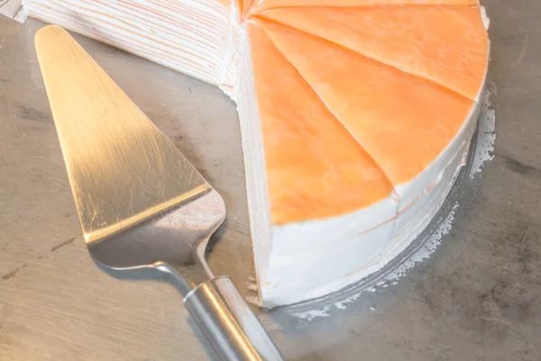 Piece of orange crepe cake — Stock Photo, Image