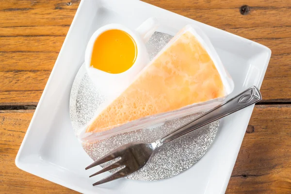 Orange whipped cream crepe cake on top view — Stock Photo, Image