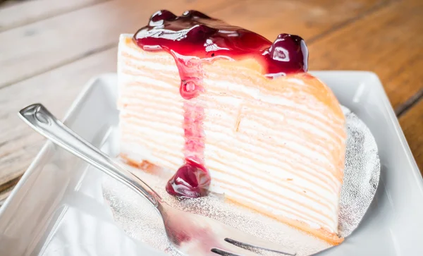 Delicious crepe cake with blueberry melt sauce — Stock Photo, Image