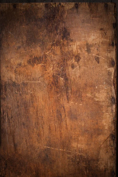 Wooden Panel with the Hammered Rusty Nails on the Edge
