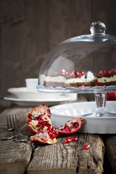 Pomegranate on the Festive Old Wooden Table with Cakes on Backgr — Stock Photo, Image