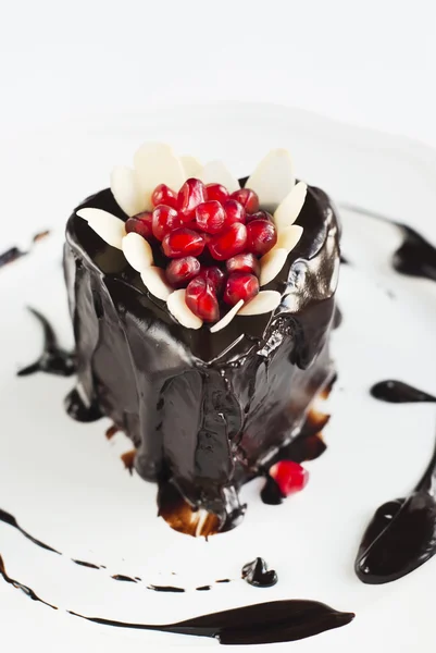 Chocolate Cake Decorated with Pomegranate and Almonds on White P — Stock Photo, Image