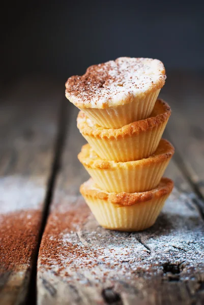 Tower from tartlets on the wooden background — Stock Photo, Image
