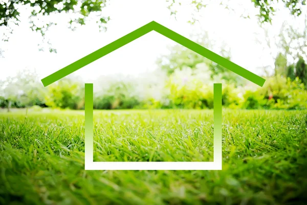 Symbol of House on a green landscape — Stock Photo, Image