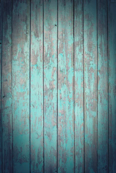 Старые деревянные доски с треснувшей синей краской, виньетка — стоковое фото
