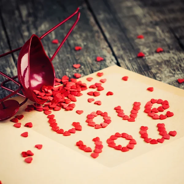 Red Tiny Hearts from letter, square image — Stock Photo, Image