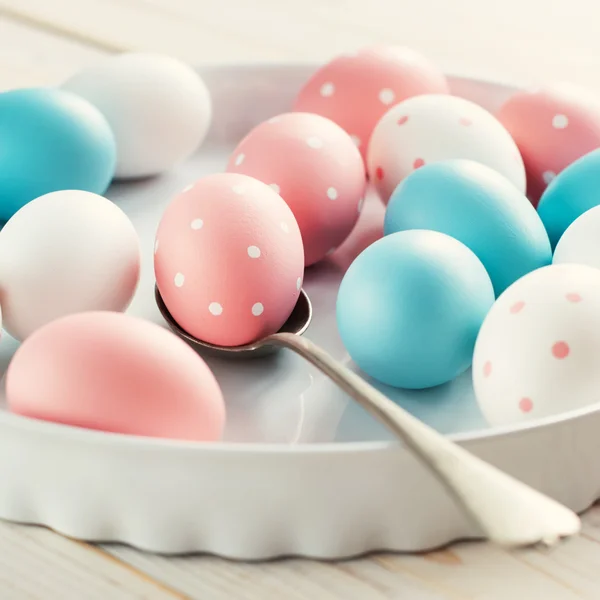 Easter Eggs painted pastel colors and peas — Stock Photo, Image