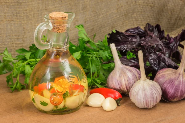 Oil infused with garlic, ingredients and spices — Stock Photo, Image