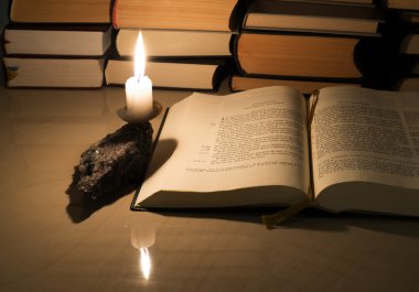 Gospel New Testament, candle and other books clipart