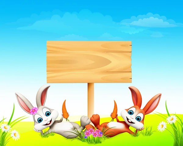 Bahagia menikmati kelinci dengan tanda kayu — Stok Foto