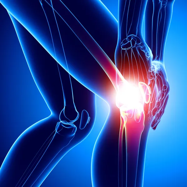 Ženské koleno bolest v modrém — Stock fotografie