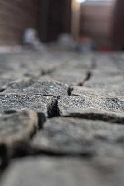 Stone pavement in perspective. Stone pavement texture. Granite cobblestoned pavement background. — Stock Photo, Image