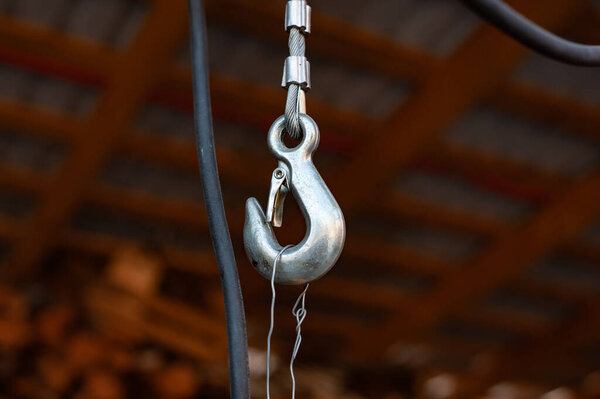 Lifting mechanism iron chain with a hook of an overhead crane