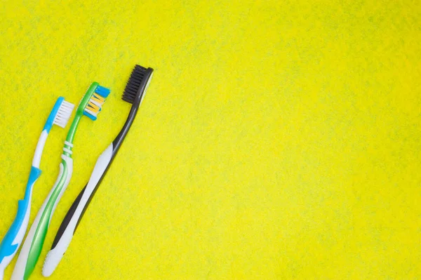 Toothbrushes Yellow Background Health Care Dental Hygiene Space Text Top — Stock Photo, Image