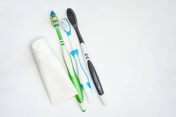 Three Toothbrushes Adults Children Tube Paste Isolated White Background Place — Stock Photo, Image