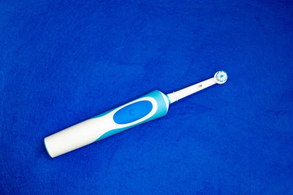 Modern Electric Toothbrush Standing Blue Background Controlled Tool Daily Oral — Stock Photo, Image