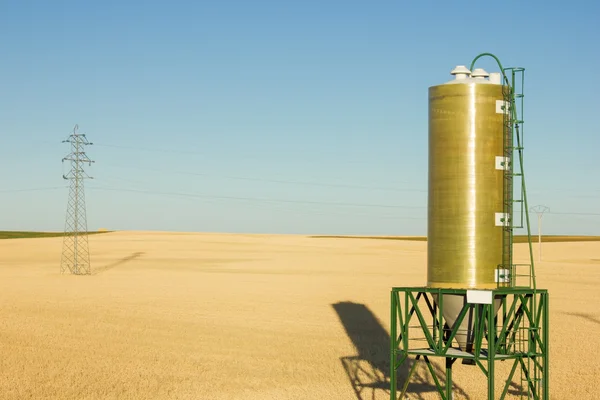 Water tower on the wheat field — Stock Photo, Image