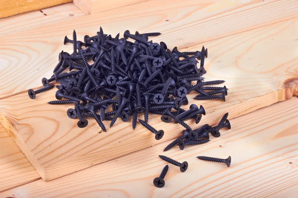 Screws on board — Stock Photo, Image