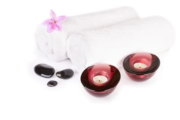 Spa and wellness setting with natural stones, candles and towel — Stock Photo, Image