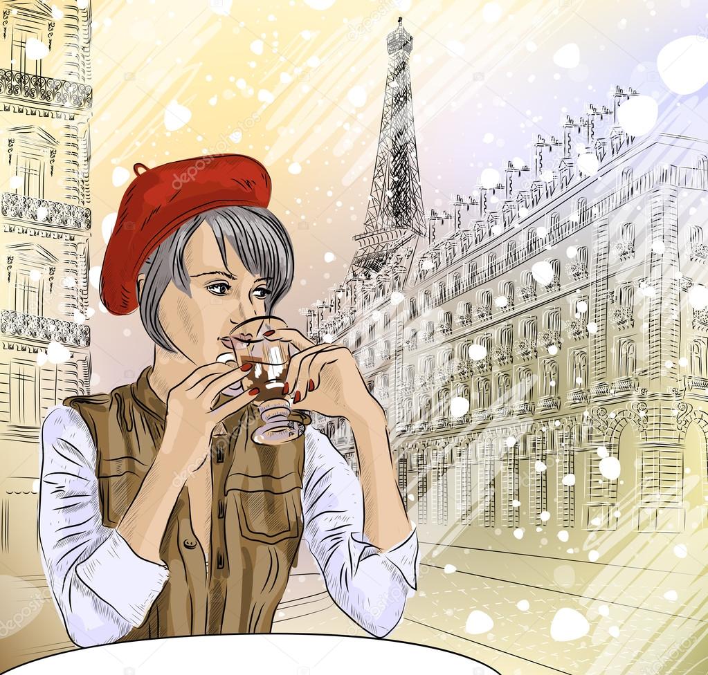 Beautiful girl in the street cafe in Paris drinking coffee