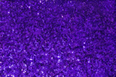 Kumaş dokusu 2022 'de ışıldayan soyut arkaplan pullarla ışıldayan tekstil. Balık pullu çok peri kumaşı.