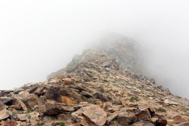 View of landscape with fog in alps, Italy