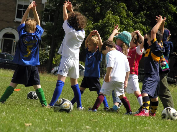 Little kids on football training in the park — Zdjęcie stockowe