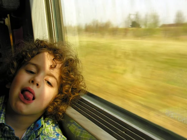 Menino entediado na viagem de trem — Fotografia de Stock