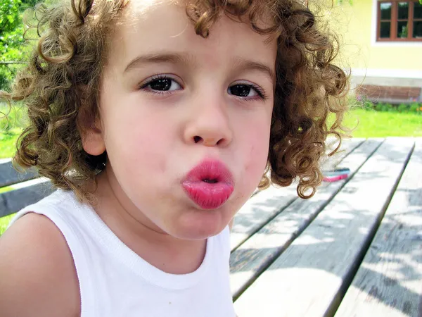 Little boy giving a kiss — Stock Photo, Image