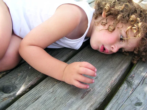 Little boy lying on the table — Stock Photo, Image