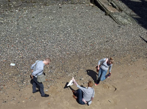 People with clothes on the beach — Stock Photo, Image