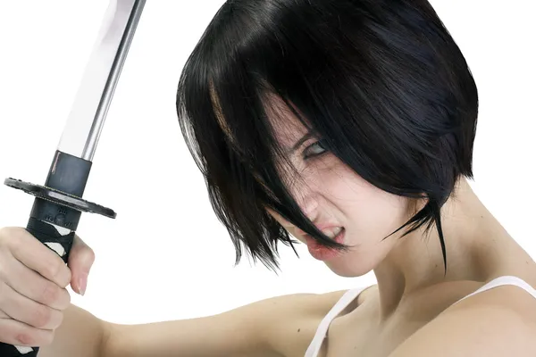 Meisje met een strenge blik houden een katana zwaard — Stockfoto