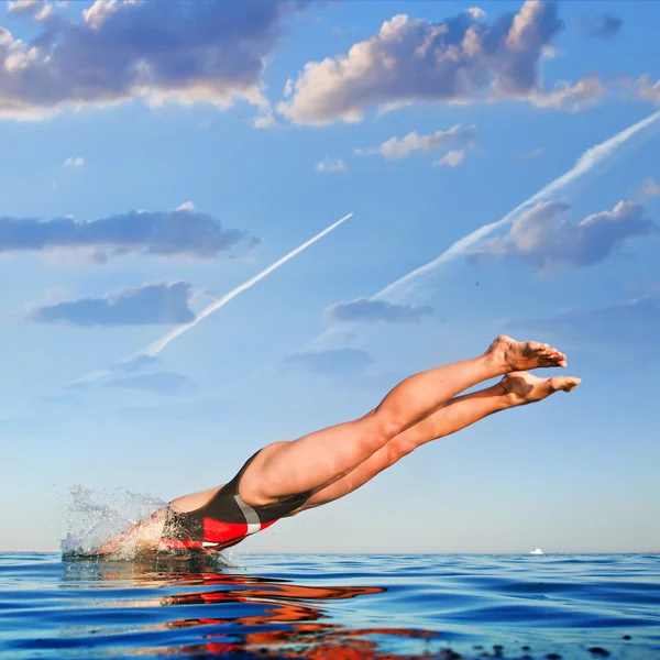 Female professional swimmer jumping — Stock Photo, Image