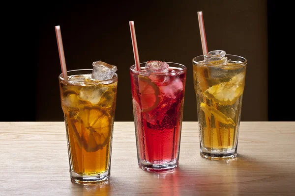 Colourful fruit cocktails in glasses — Stock Photo, Image