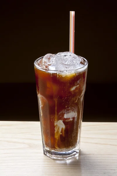 Fresh brown cocktail in glass with ice — Stock Photo, Image