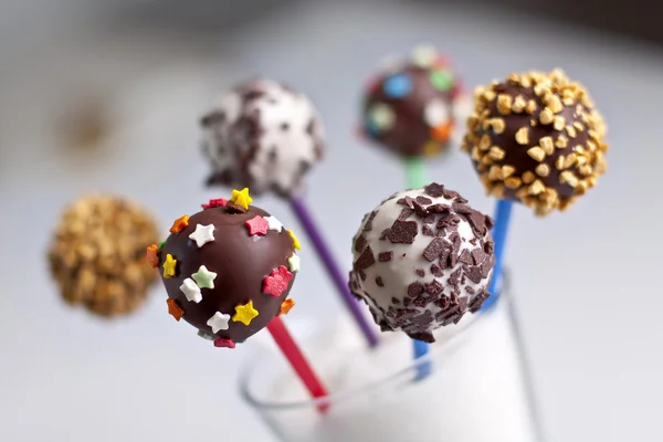 Dulces de chocolate en un palo — Foto de Stock