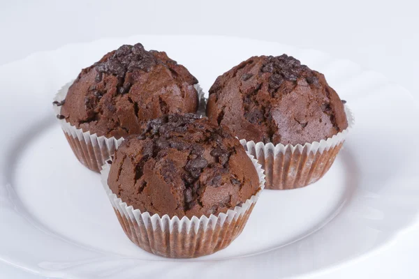 Delicious chocolate muffin on a white background — Stock Photo, Image