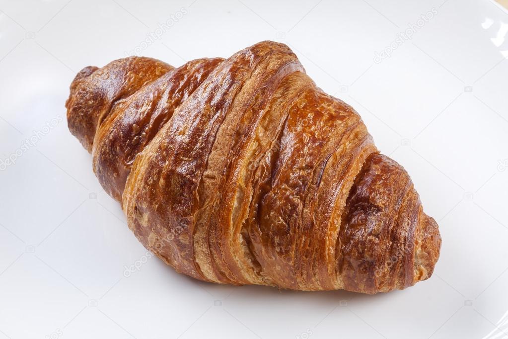 Appetizing croissant on a plate