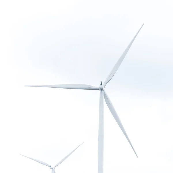 Windturbine in windpark tegen bewolkte hemel — Stockfoto