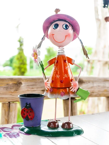 Cute smile doll with a beautiful basket on dining table — Stock Photo, Image